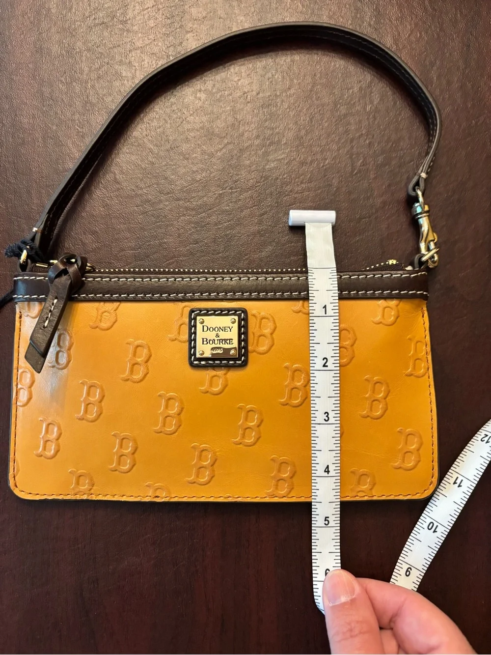 Dooney & Bourke Mustard Yellow Logo-Embossed Wristlet with Brown Trim